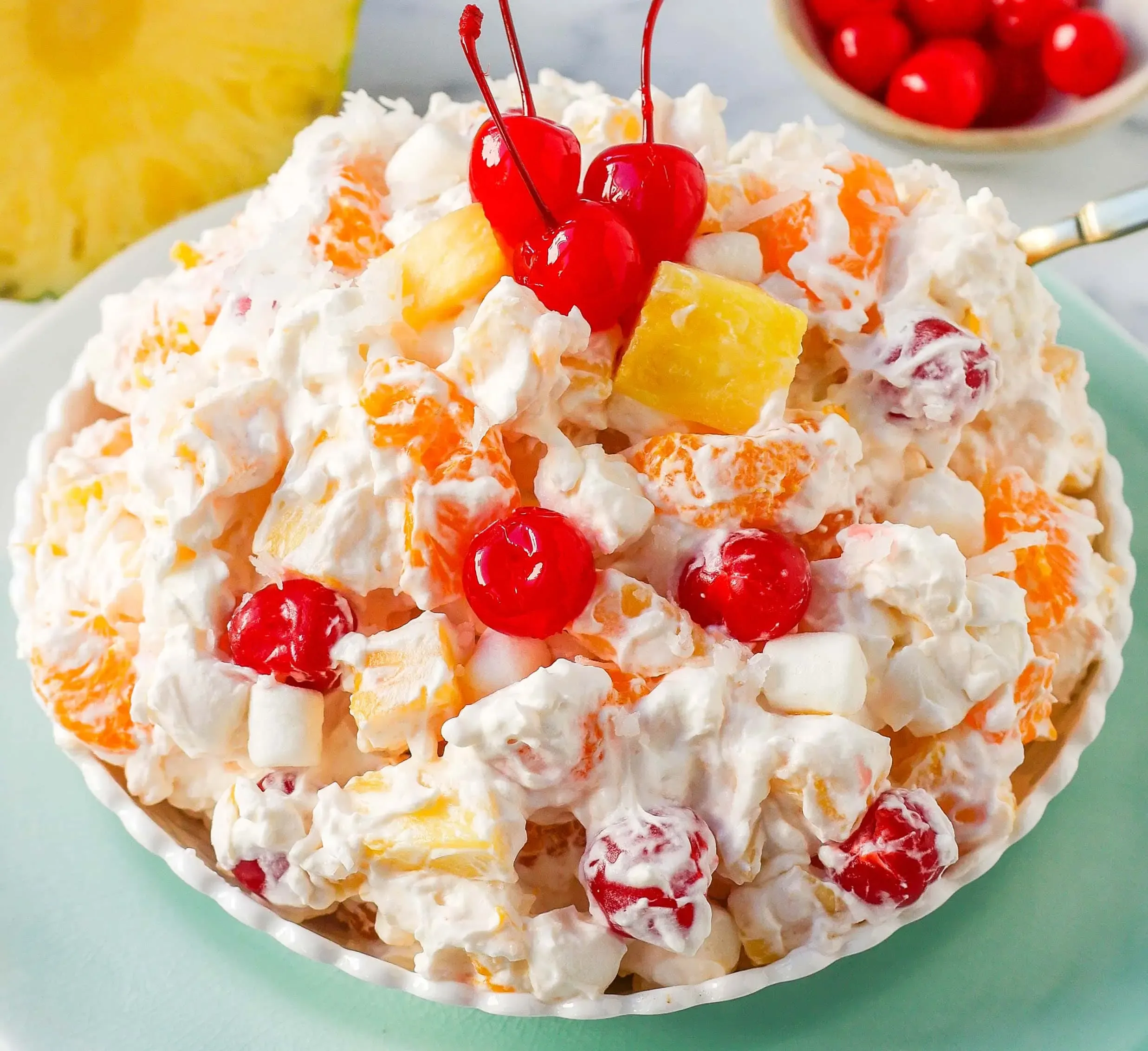 Mixing Your Ambrosia Fruit Salad with Sour Cream
